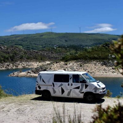VW Transporter T4 with a lake on the background